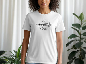 White t-shirt with black text that reads "BE unapologetically YOU."