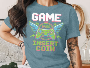 "GAME OVER INSERT COIN" text with pixelated controller and wings graphic.