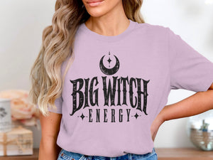 Lilac t-shirt with black "Big Witch Energy" text and moon graphic.