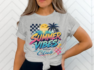 Grey t-shirt with "Summer Vibes Social Club" graphic featuring palm trees, sunset, and checkered patterns.