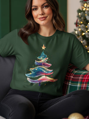 Green t-shirt with a colorful, abstract Christmas tree design.