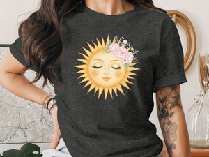 Dark grey t-shirt with a sun graphic adorned with pink flowers.