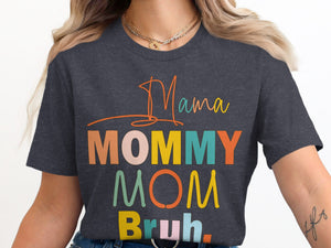 Dark gray t-shirt with "Mama Mommy Mom Bruh" text in colorful block letters.