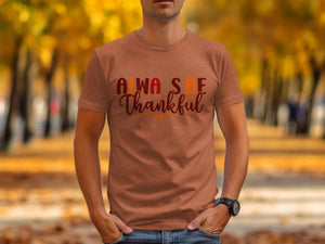 Brown t-shirt with "Always Be Thankful" text and fall leaf graphics.