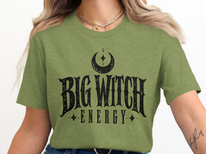Green t-shirt with black "Big Witch Energy" text and crescent moon graphic.