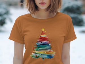 Orange t-shirt with a watercolor Christmas tree design and ornaments.