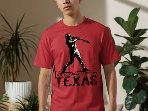 Red t-shirt with a black graphic of a baseball player and text "It's baseball time in TEXAS".
