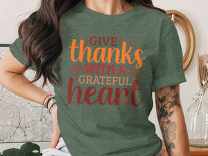 Green t-shirt with text "Give thanks with a grateful heart"