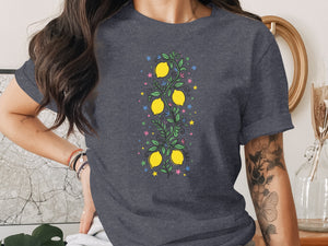Dark grey t-shirt with a vertical illustration of lemons, leaves, and stars.