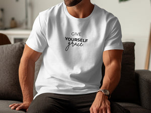 White t-shirt with "GIVE YOURSELF grace." text on chest.