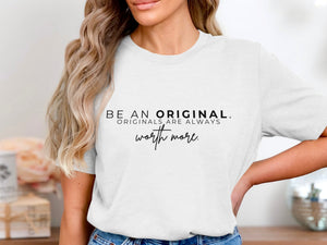White t-shirt with black text "BE AN ORIGINAL. ORIGINALS ARE ALWAYS worth more."