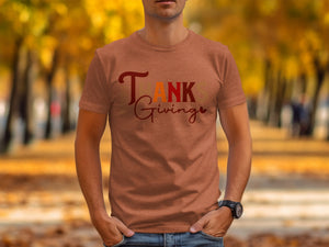 T ANKS Giving t-shirt on a man with hands in pockets.