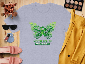 Light grey t-shirt with green butterfly made of hearts and "Mental Health Awareness" text.