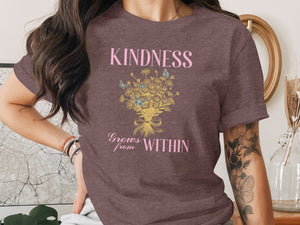 Brown t-shirt with pink text "KINDNESS Grows from WITHIN" and floral design.