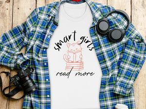 White t-shirt with "smart girls read more" graphic featuring a cat reading a book.