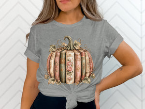 Gray t-shirt featuring a pumpkin made of antique books with floral accents.