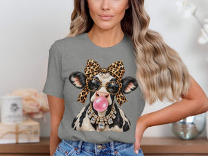 Cow wearing sunglasses, leopard bow, diamond necklace, and blowing bubble gum.