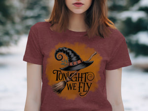 Black witch hat and broom graphic with text "Tonight we fly".