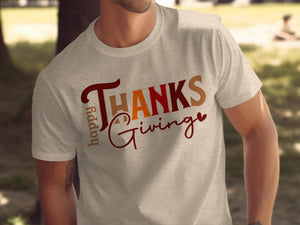 Light gray t-shirt with "Happy Thanks Giving" text in a playful font.