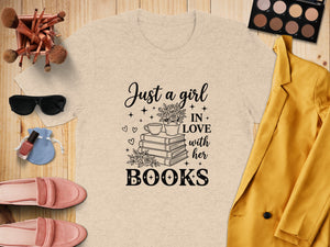 Light beige t-shirt with "Just a girl IN LOVE with her BOOKS" graphic.