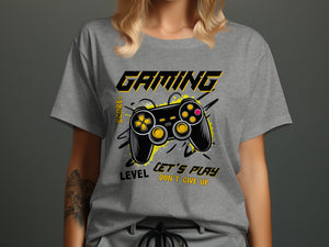 Gray t-shirt with "Gaming" text and a black video game controller with yellow accents.