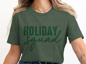 Green t-shirt with "HOLIDAY SQUAD" text in a distressed font.