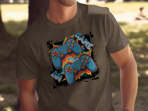Brown t-shirt with graphic featuring two blue video game controllers and text.
