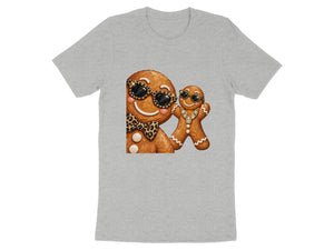 Two gingerbread cookies with sunglasses and jewelry on a grey t-shirt.