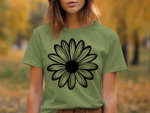 Green t-shirt with black outlined daisy graphic on chest.