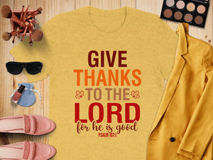 Yellow t-shirt with "GIVE THANKS TO THE LORD for he is good PSALM 107:1" text.