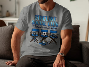 Grey t-shirt with graphic of director's chairs, soccer ball, cleats, gloves, and stopwatch.
