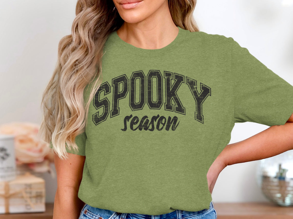 Green t-shirt with "SPOOKY season" graphic in distressed black lettering.
