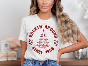 White t-shirt with red graphic "Rockin' Around Since 1958" and Christmas tree.