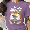 Purple t-shirt with "Gilmore Ghouls Where You Haunt, I Will Follow" and two ghosts.