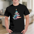 Black t-shirt with a watercolor Christmas tree graphic and scattered dots.