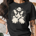 Black t-shirt with three cartoon ghosts and black bows, surrounded by polka dots.
