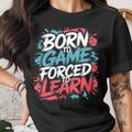 Black t-shirt with "Born to Game Forced to Learn" text graphic.