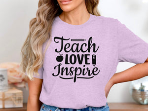 Purple t-shirt with "Teach Love Inspire" text and apple and pencil graphics.