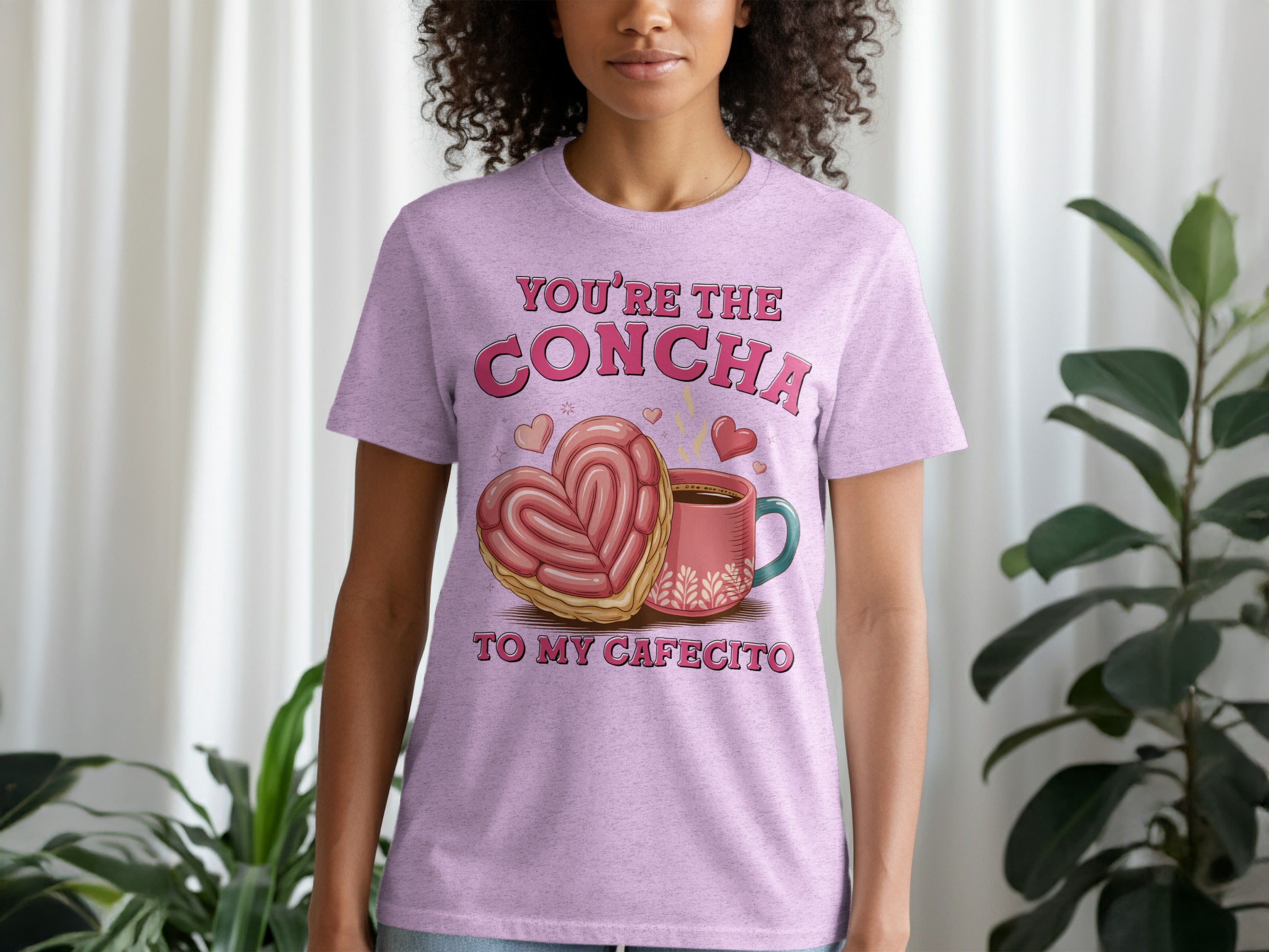 Pink t-shirt with "You're the concha to my cafecito" and heart concha graphic.