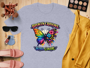 Gray t-shirt with butterfly graphic and text "BROKEN CRAYONS STILL COLOR".