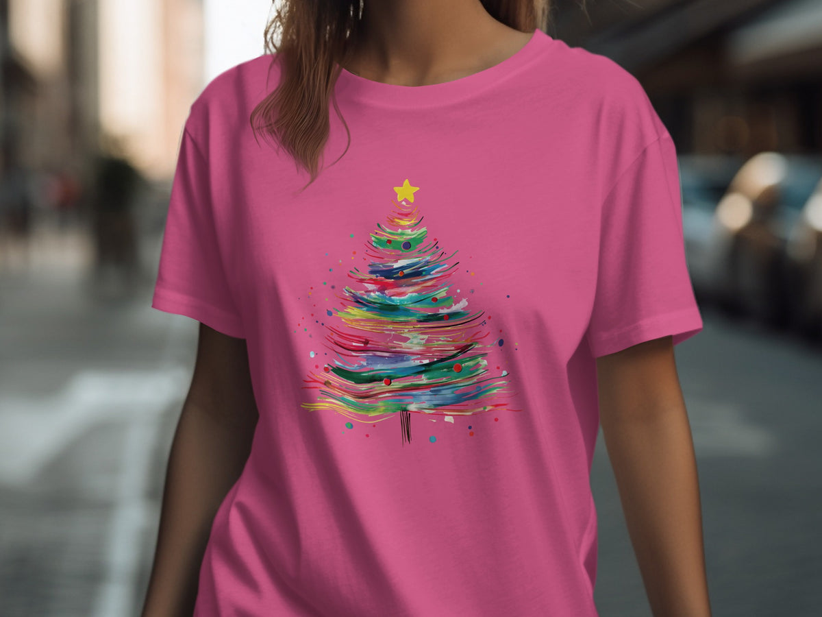 Pink t-shirt with abstract colorful Christmas tree design and yellow star.