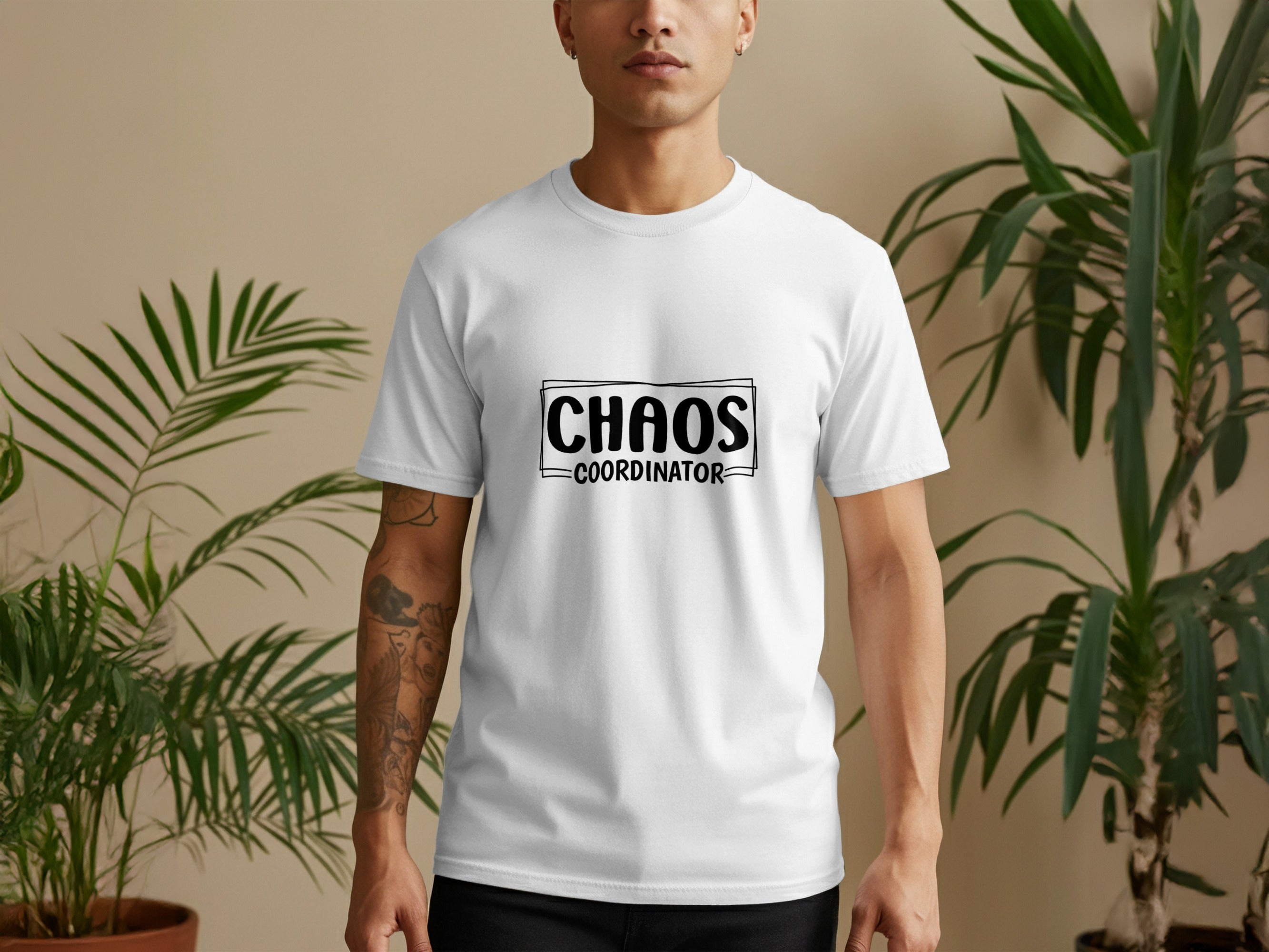 White t-shirt with black text reading "CHAOS COORDINATOR" in a rectangular box.