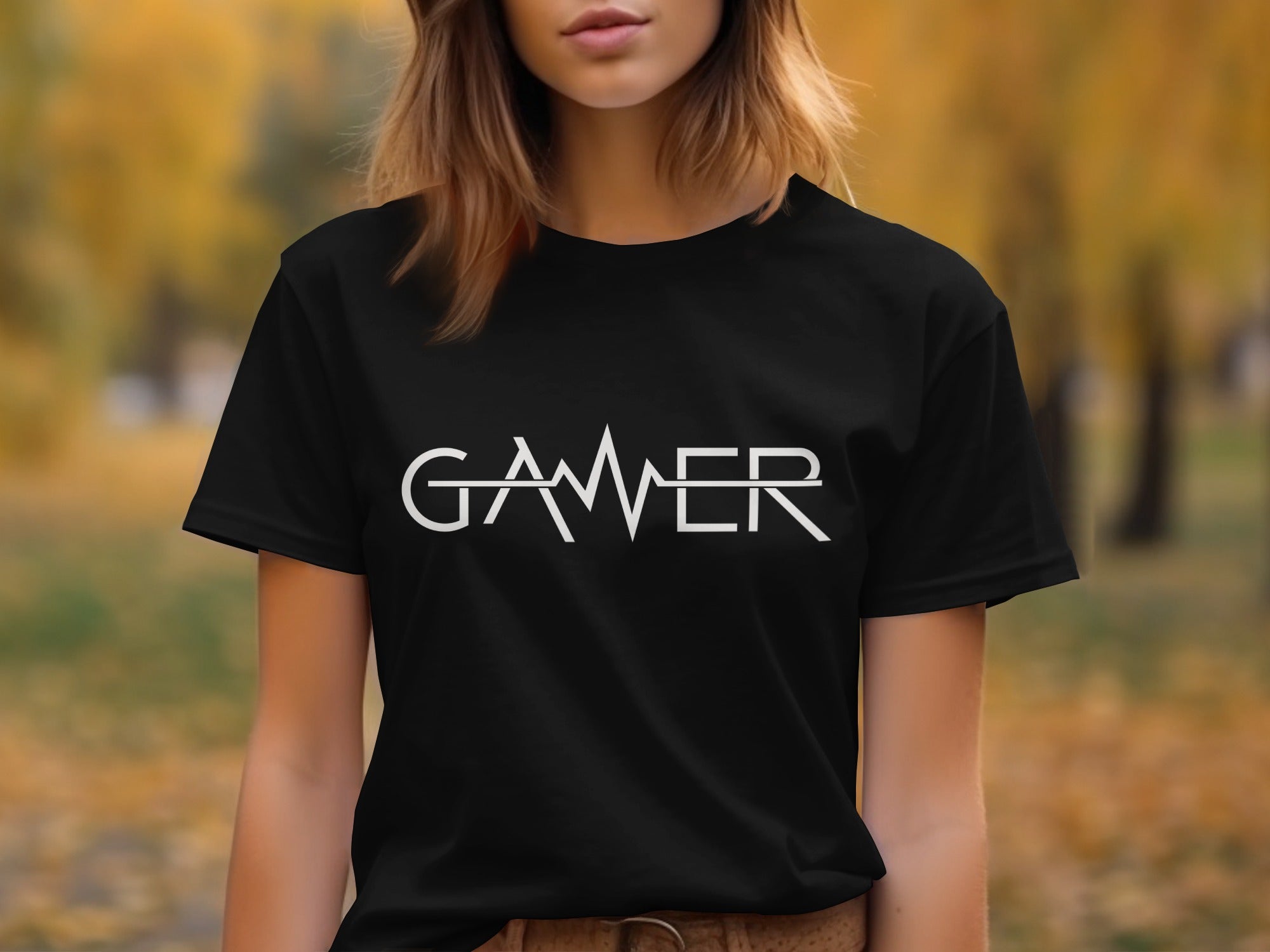 Black t-shirt with white "GAMER" text in a minimalist, geometric font.