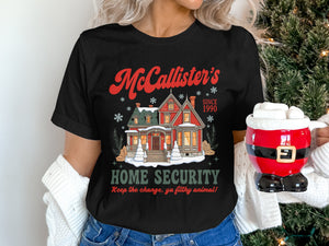McCallister's Home Security t-shirt with a winter house graphic and quote.
