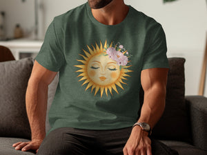 Green t-shirt with a sun graphic adorned with pink flowers and leaves.