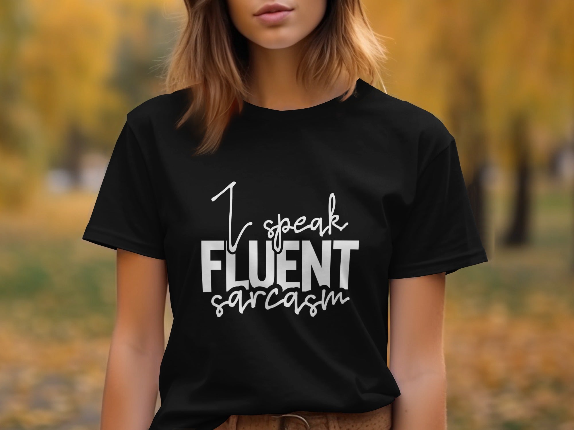 Black t-shirt with white text "I speak FLUENT sarcasm"