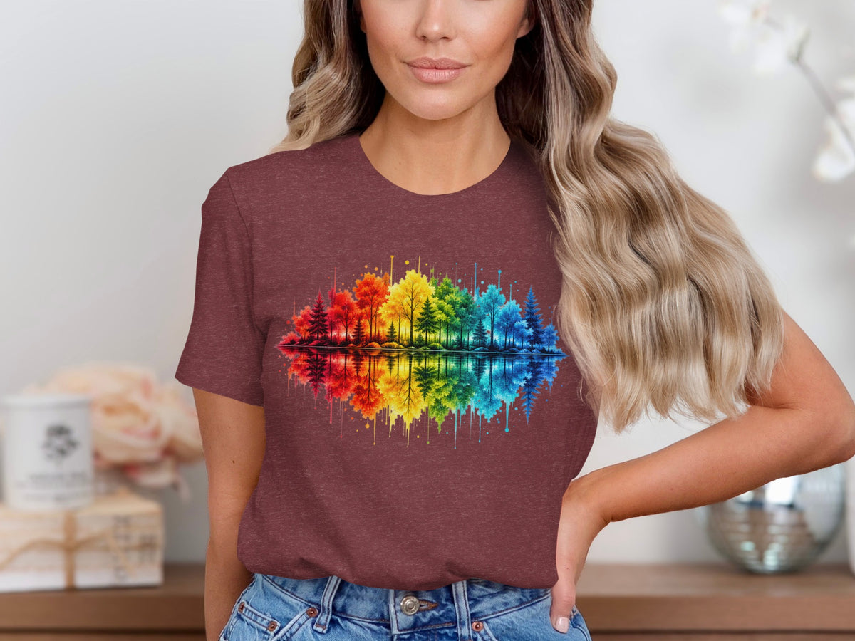 T-shirt with watercolor rainbow forest and reflection graphic.