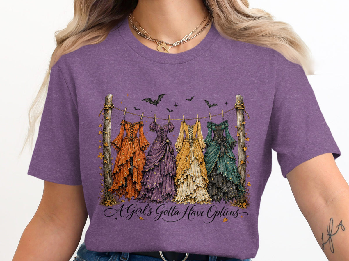Four ornate dresses hang on a clothesline with bats overhead and text "A Girl's Gotta Have Options".
