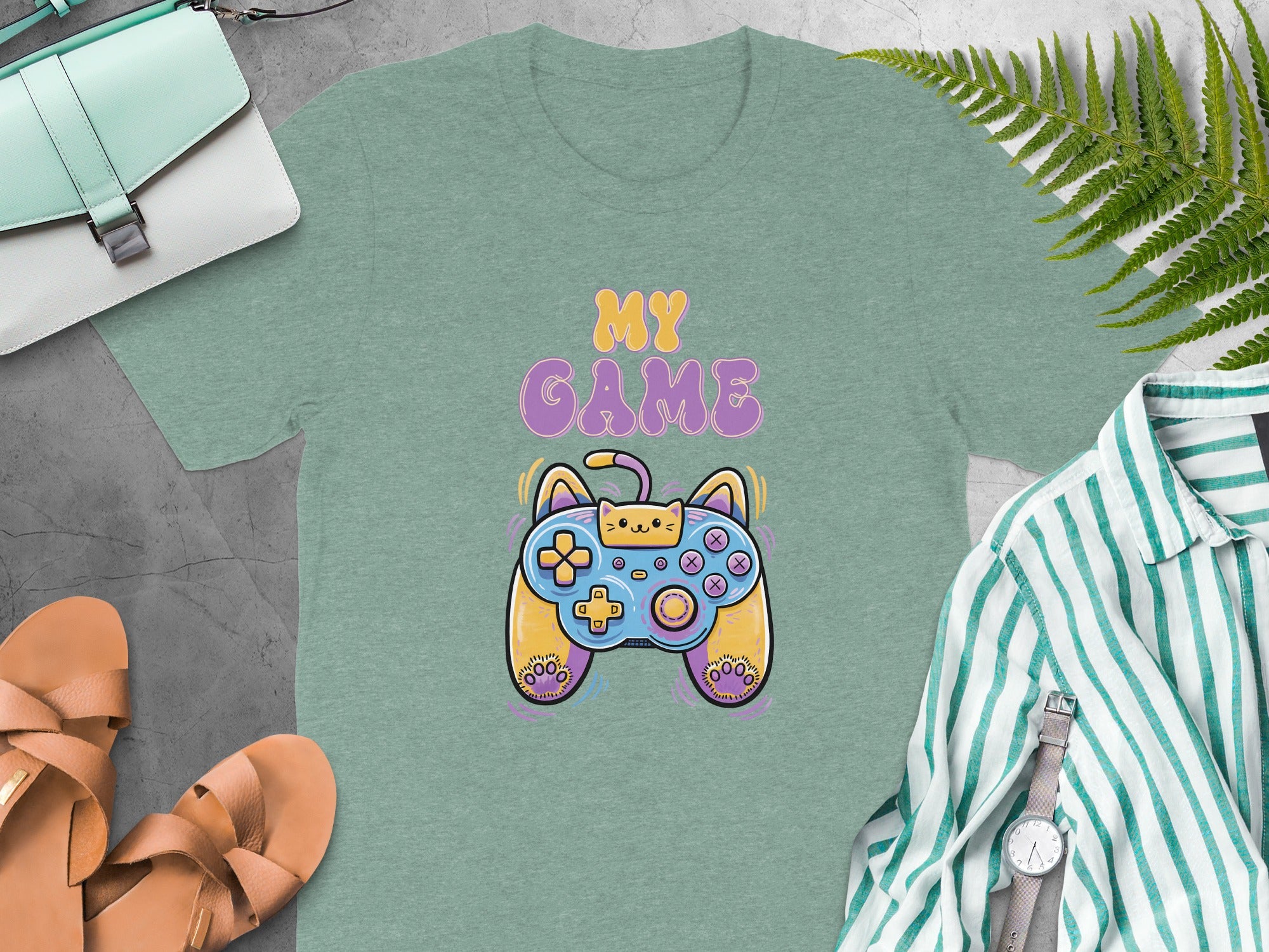Green t-shirt with "MY GAME" text and a cat-themed video game controller graphic.
