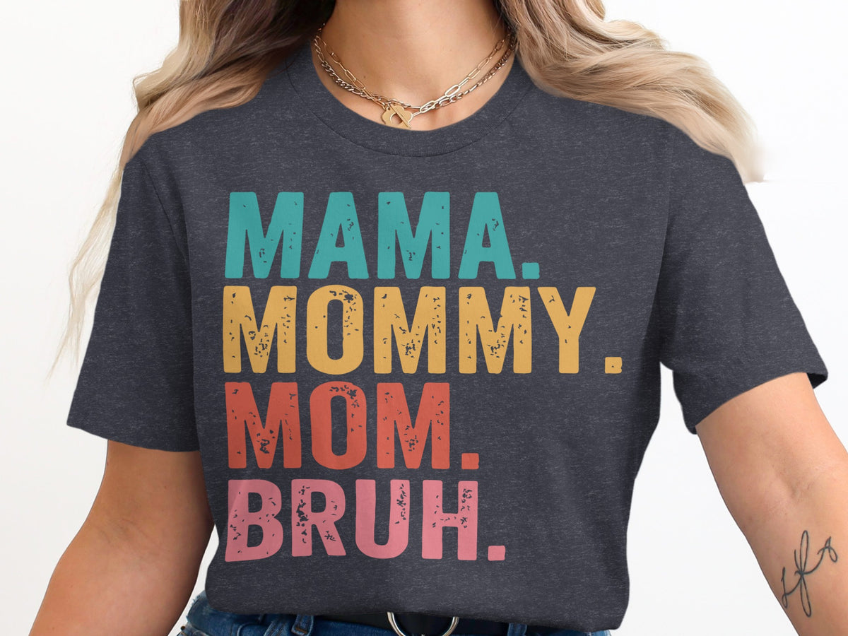 Dark grey t-shirt with "MAMA. MOMMY. MOM. BRUH." text in teal, yellow, red, and pink.